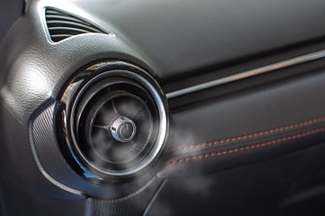 Cool air flowing from a vehicle's dashboard air-con vent.